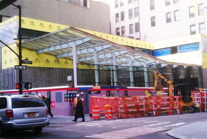 Glass oculus of the Fulton Street Transit Center beside the landmark Corbin Building