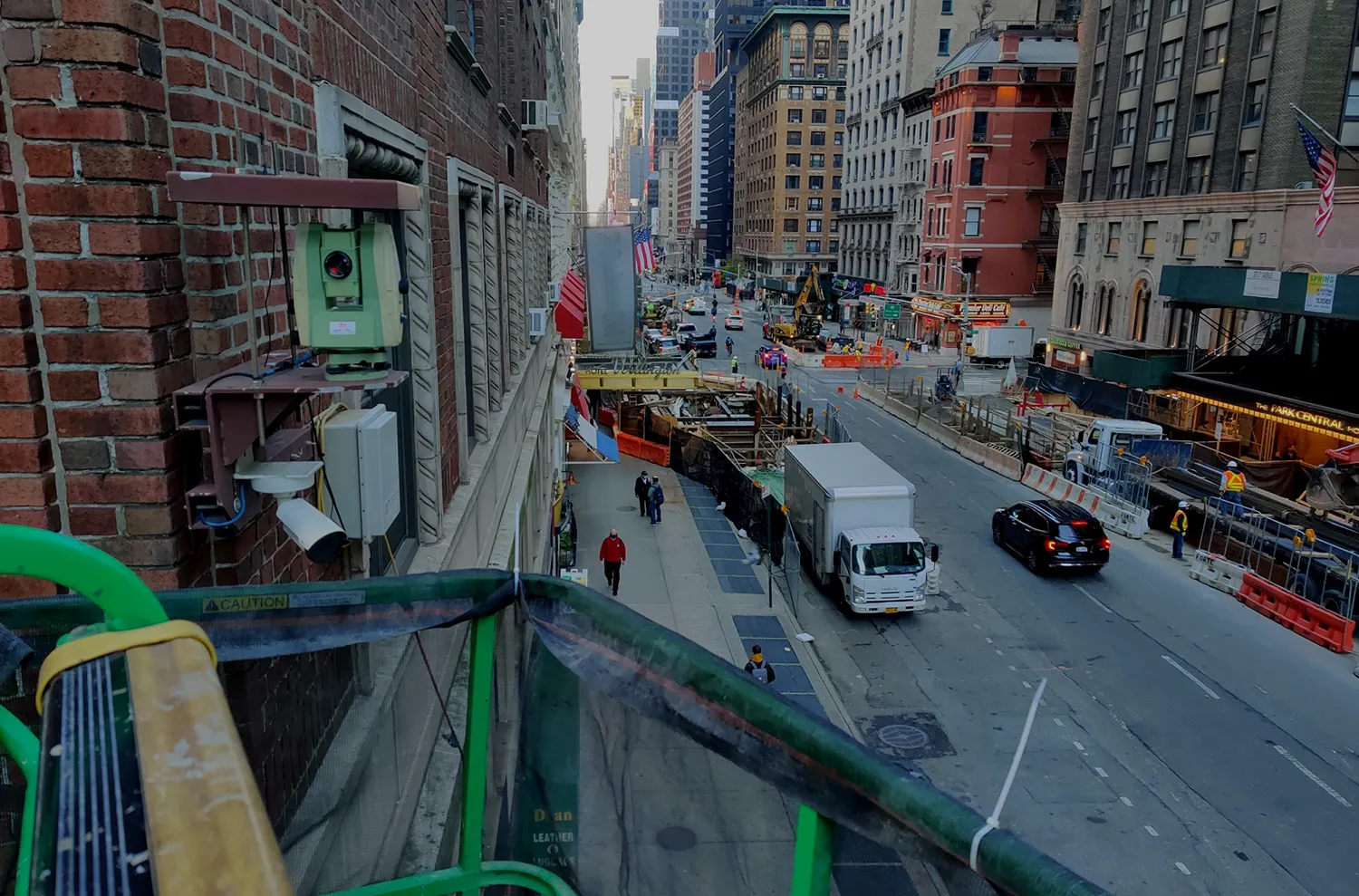 Robotic total station monitoring an urban construction site